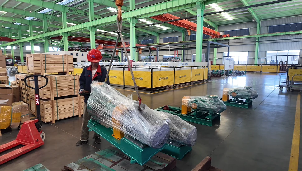 Wrapped industrial pump assemblies arranged in the Changyu workshop during preparation for shipment to Brazil.