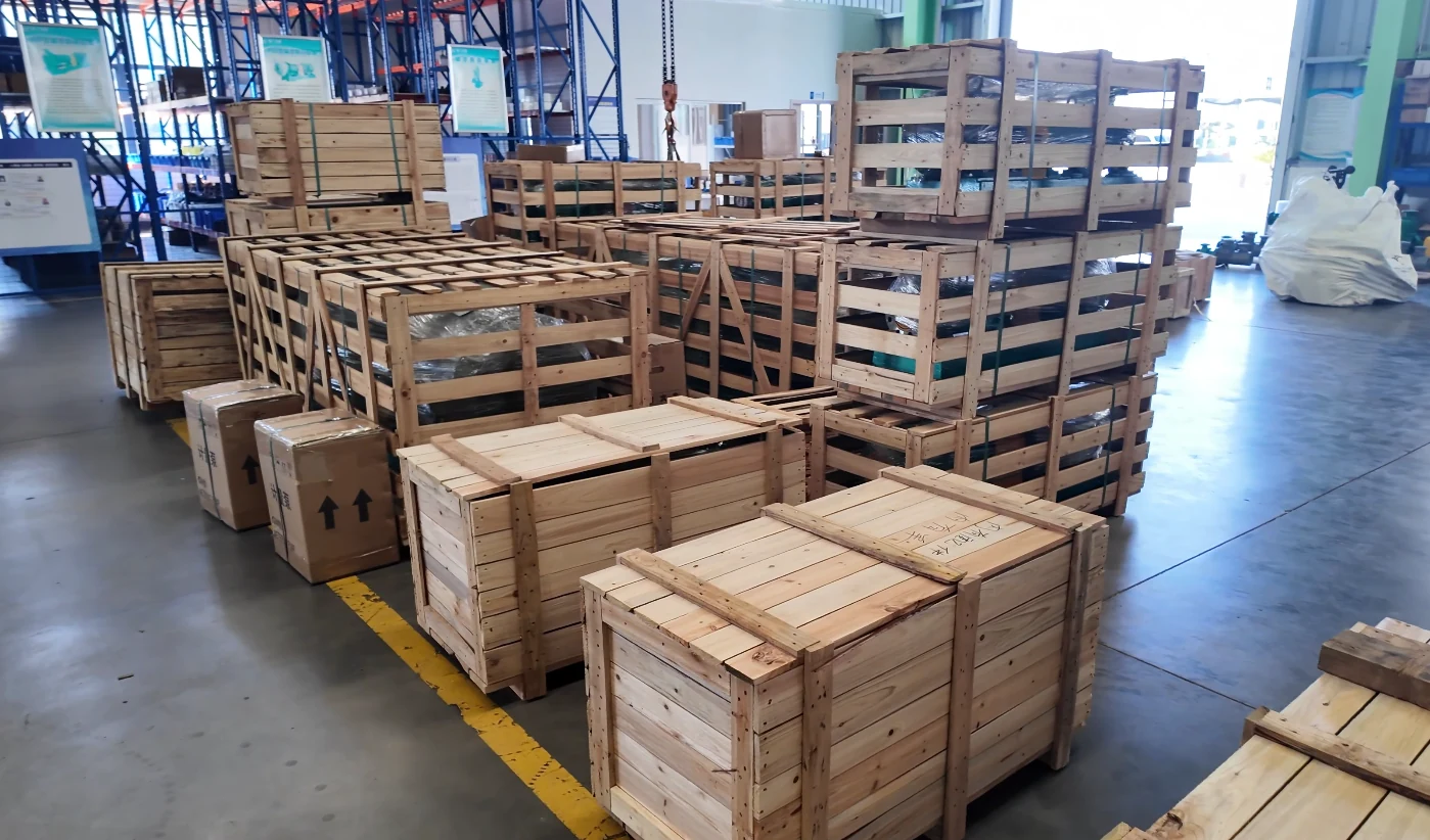 Wooden crates and packed industrial pump equipment in the Changyu factory dispatch area for the Brazil shipment.
